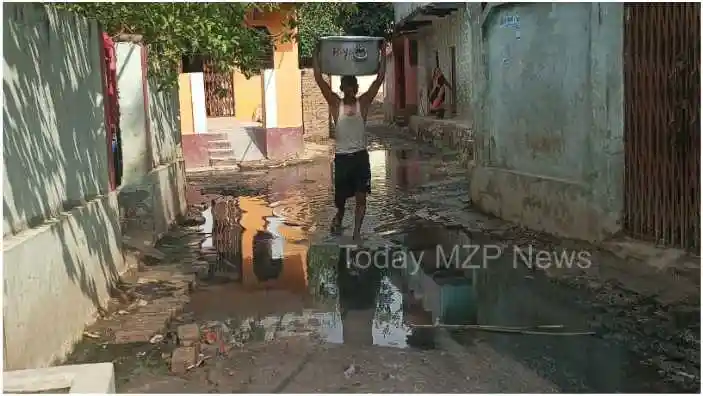 Mirzapur Harsinghpur Villagers passing through dirty water flowing on the road 1