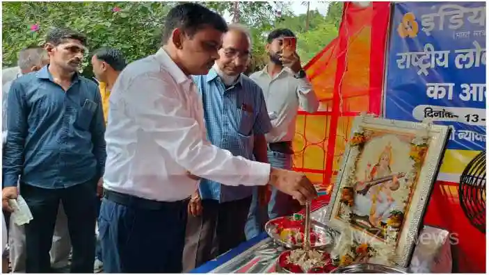 Mirzapur The District Judge inaugurated the Lok Adalat by lighting the lamp