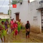 Mirzapur Chunar Women planting paddy on a muddy road