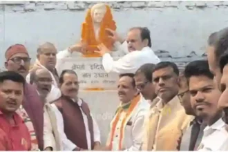 Garlanding the statue of Indira Gandhi on her birth anniversary