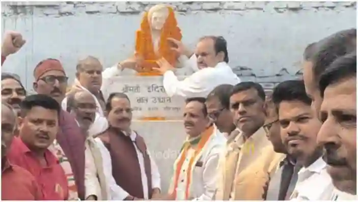 Garlanding the statue of Indira Gandhi on her birth anniversary