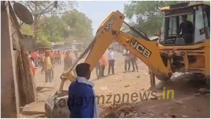 On the orders of DM encroachment is being demolished by JCB